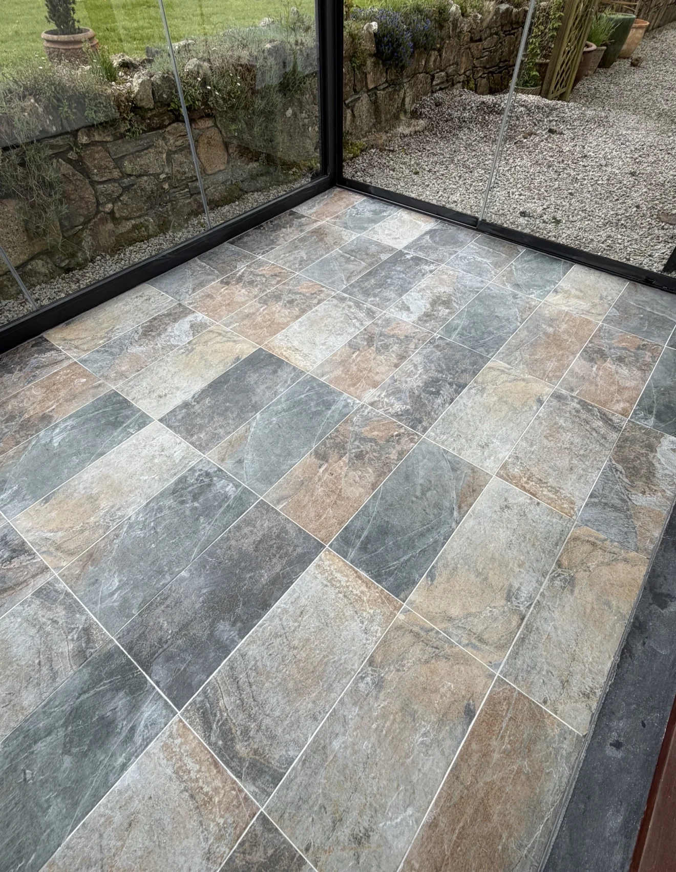 Slate effect conservatory floor tiling close-up